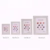 Modern képkeret 18,5×23,5 cm – 15×25 cm fotóhoz, világosszürke kőhatású kivitelben
